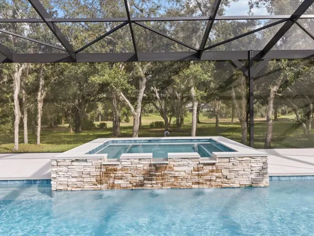 view of a balcony with wooden floor and lake view