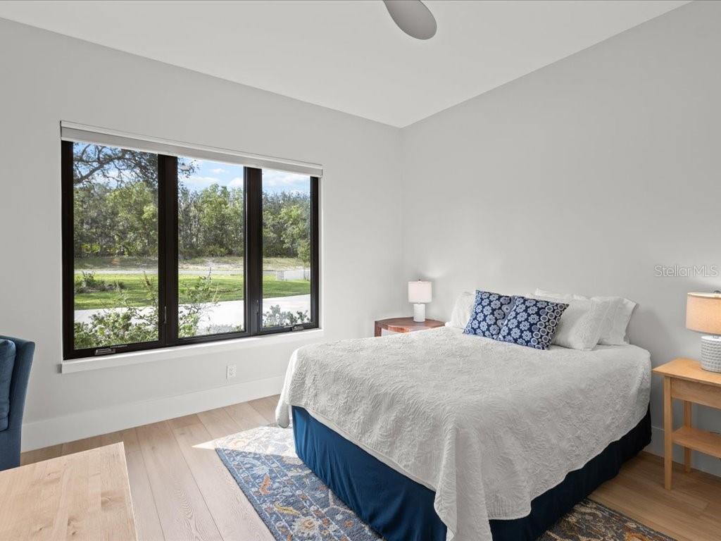 3937 West Shadow Creek Loop Lecanto, FL 34461 - Photo 23 of 65 a bedroom with a large bed and a large window