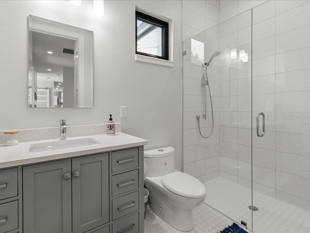 3937 West Shadow Creek Loop Lecanto, FL 34461 - Photo 25 of 65 a bathroom with a toilet sink shower and mirror