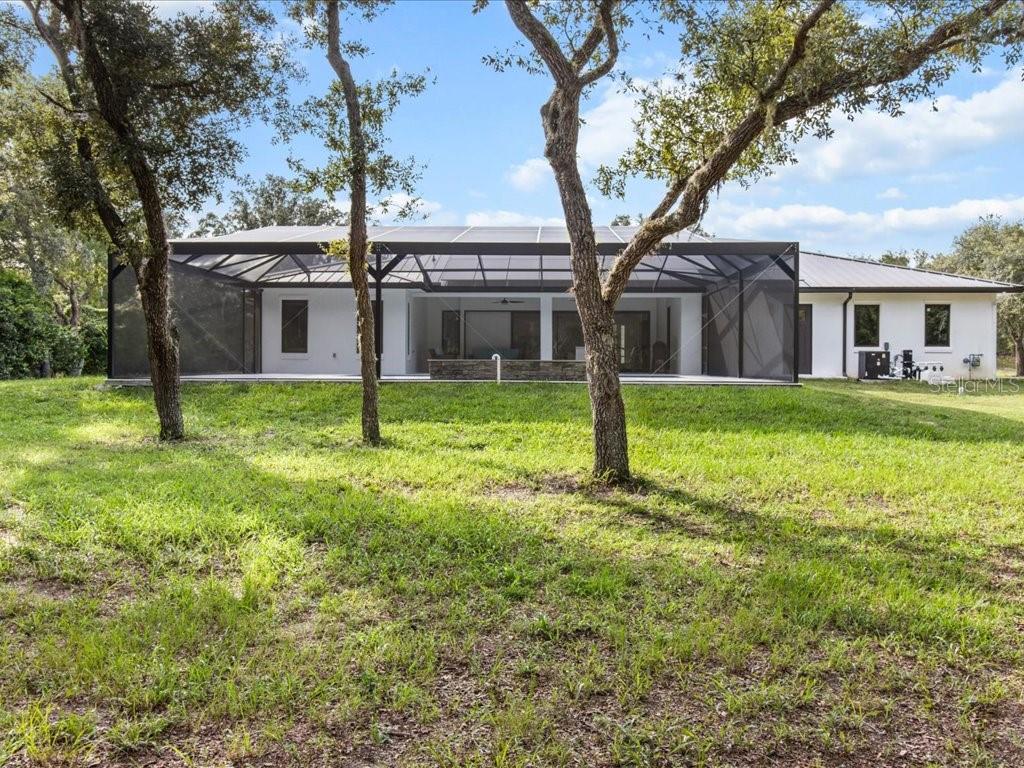 3937 West Shadow Creek Loop Lecanto, FL 34461 - Photo 37 of 65 a backyard of a house with lots of green space