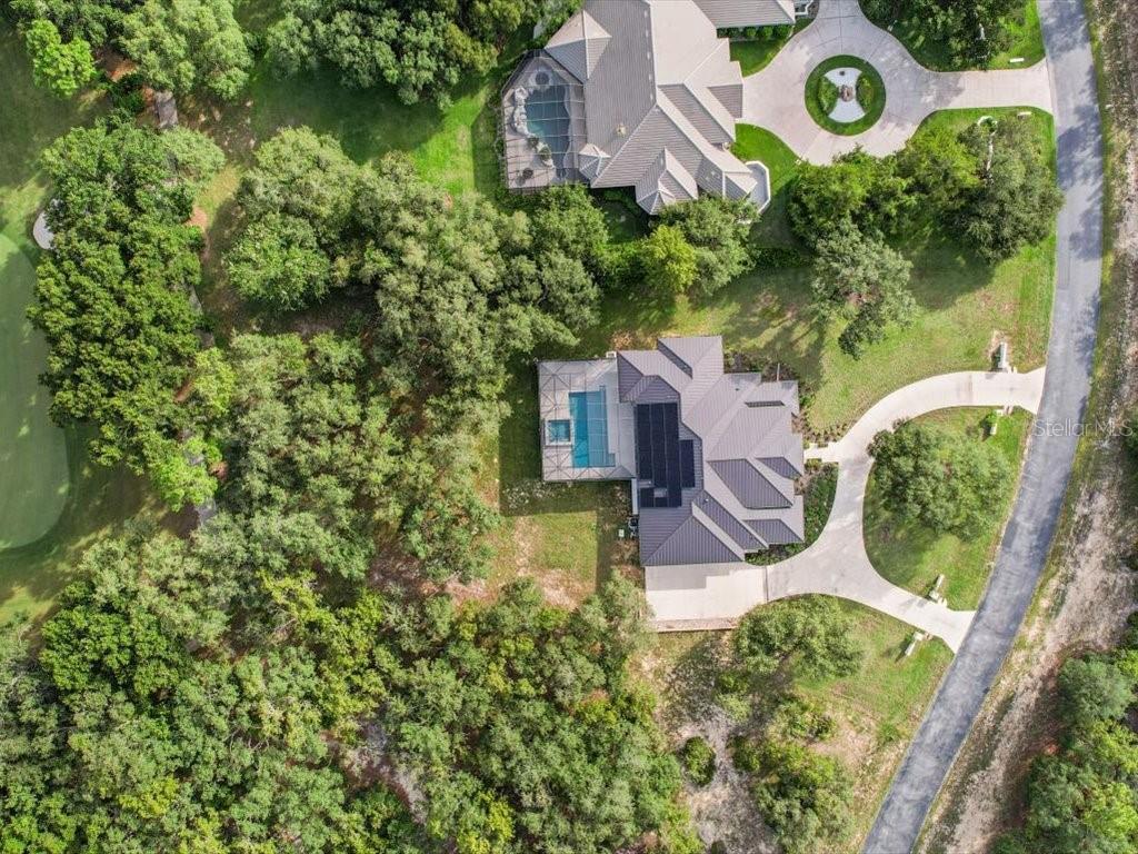 3937 West Shadow Creek Loop Lecanto, FL 34461 - Photo 41 of 65 an aerial view of a house with a yard basket ball court and outdoor seating