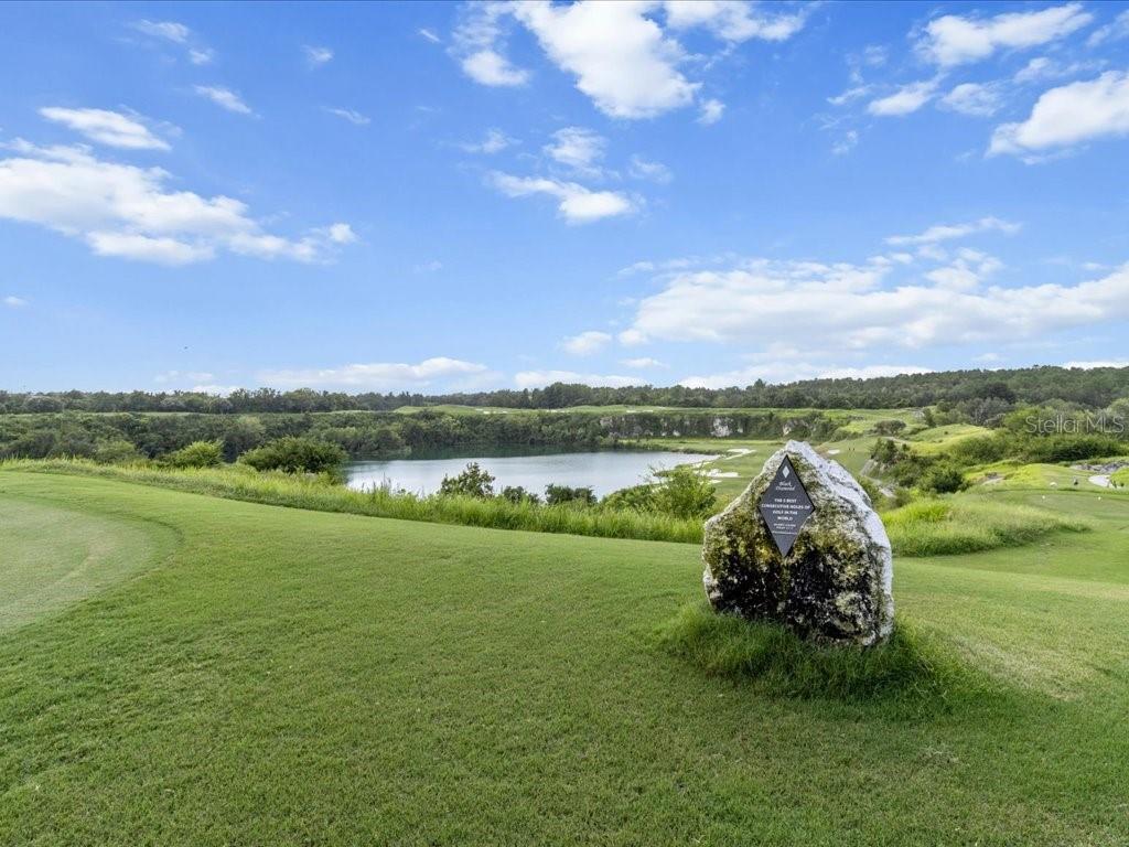 3937 West Shadow Creek Loop Lecanto, FL 34461 - Photo 45 of 65 a view of a lake with houses in the back