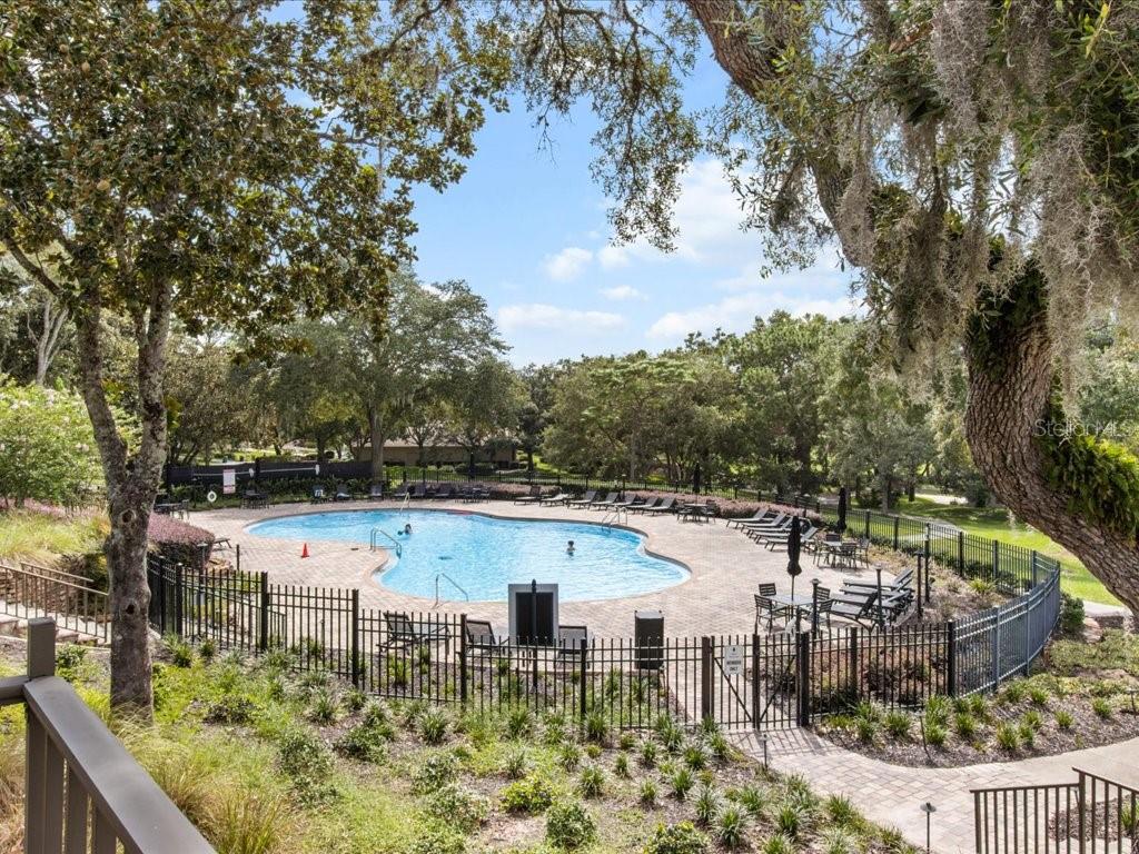 3937 West Shadow Creek Loop Lecanto, FL 34461 - Photo 63 of 65 a view of a lake with a yard from a balcony