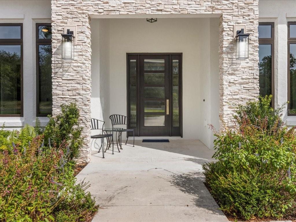 3937 West Shadow Creek Loop Lecanto, FL 34461 - Photo 7 of 65 a front view of a house with a yard