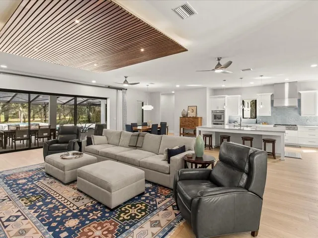 a kitchen with cabinets stainless steel appliances and a counter space