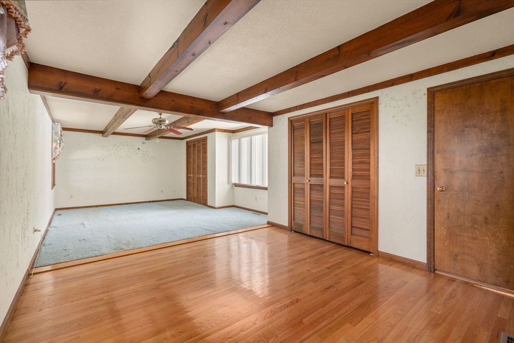 2035 Parker Street Springfield, MA 01128 - Photo 23 of 42 an empty room with wooden floor and windows