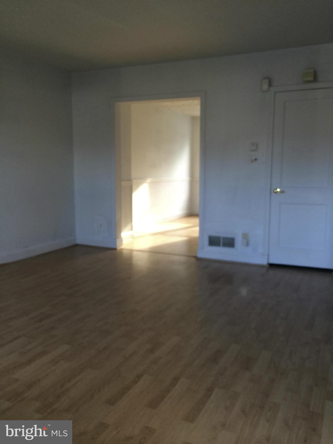 340 Grovethorn Road Baltimore, MD 21220 - Photo 6 of 17 a view of empty room with wooden floor