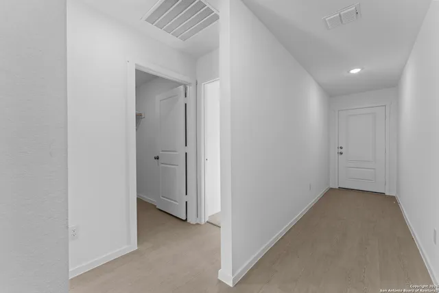 a view of an empty room and window