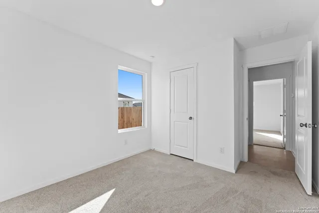 a bathroom with a toilet sink a mirror and bathtub
