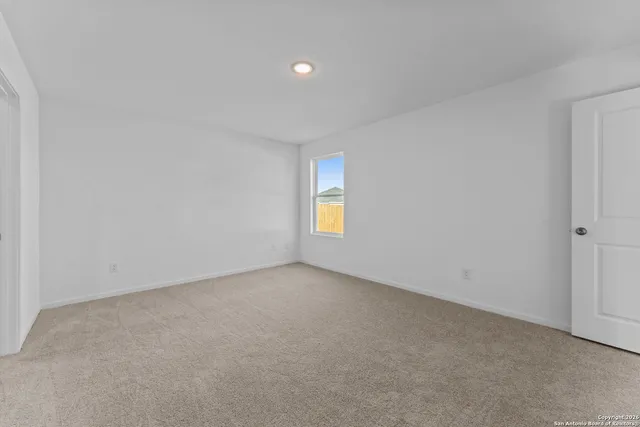 a view of a garden with a house