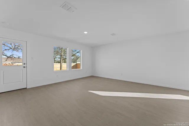 an empty room with windows