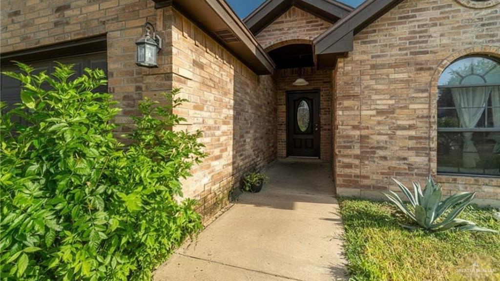 1409 Valencia Avenue Pharr, TX 78577 - Photo 2 of 11 a view of a pathway both side of house