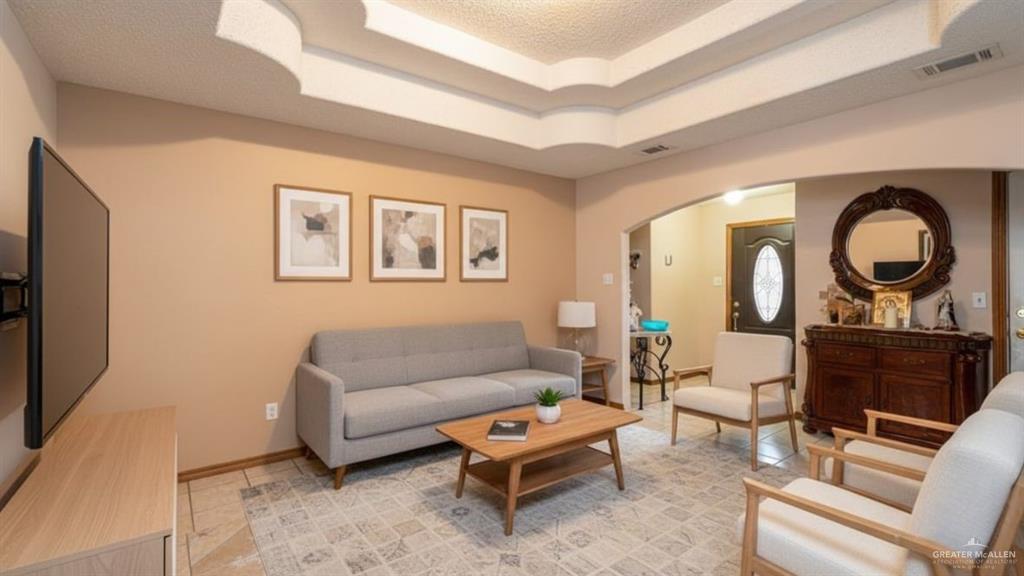 1409 Valencia Avenue Pharr, TX 78577 - Photo 3 of 11 a living room with furniture a rug and a window