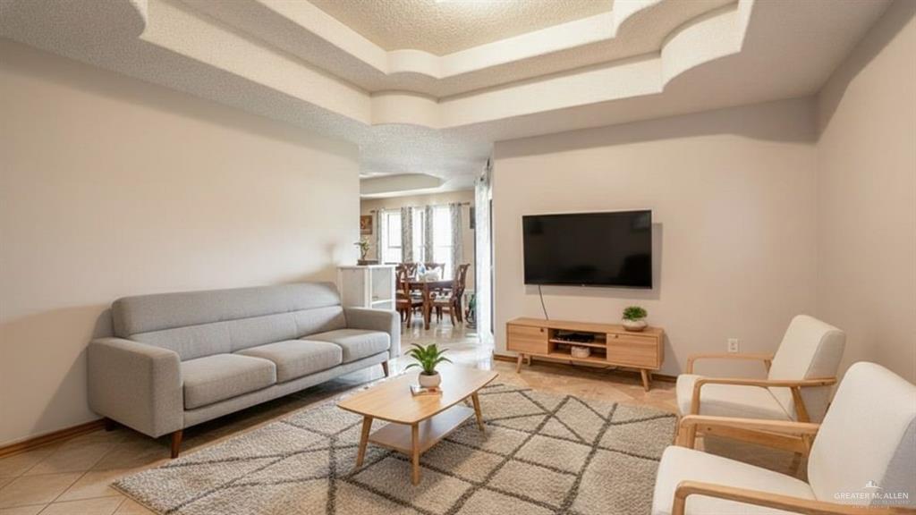1409 Valencia Avenue Pharr, TX 78577 - Photo 4 of 11 a living room with furniture and a flat screen tv