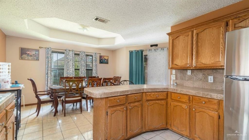 1409 Valencia Avenue Pharr, TX 78577 - Photo 5 of 11 a spacious bathroom with a granite countertop sink a mirror and a bathtub