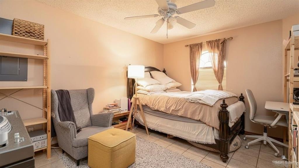 1409 Valencia Avenue Pharr, TX 78577 - Photo 7 of 11 a bedroom with a bed chair and window