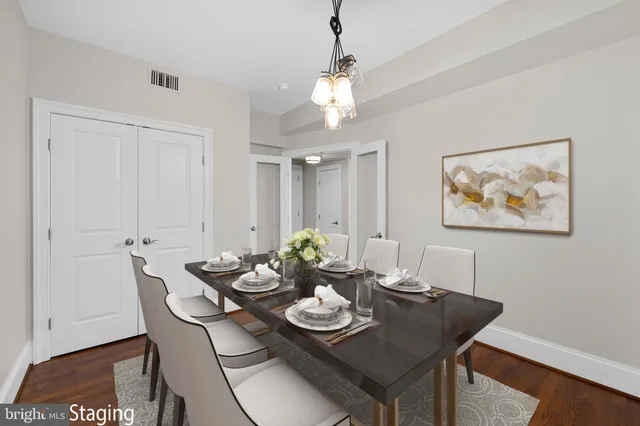 a view of a dining room with furniture and wooden floor