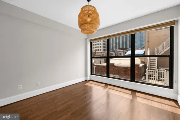 a room with window and a chandelier
