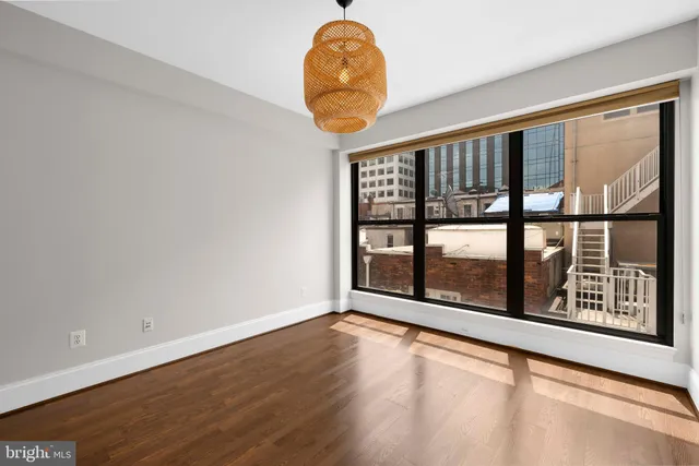 a room with window and a chandelier