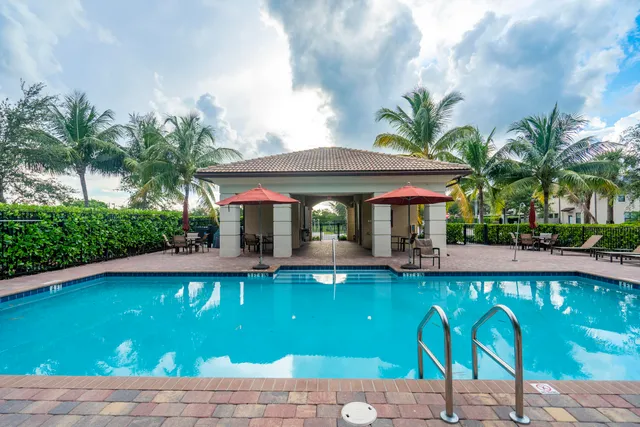 a view of a swimming pool with chairs