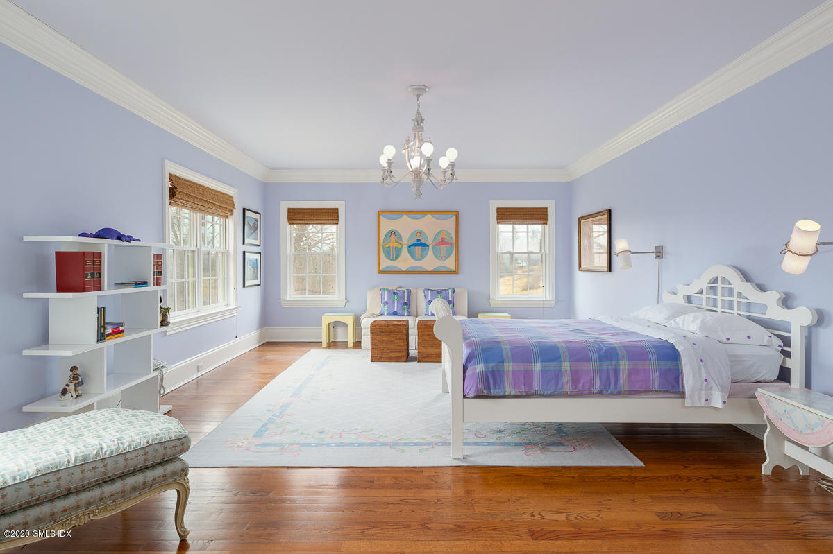 7 Chieftans Road Greenwich, CT 06831 - Photo 14 of 37 a living room with furniture and a chandelier