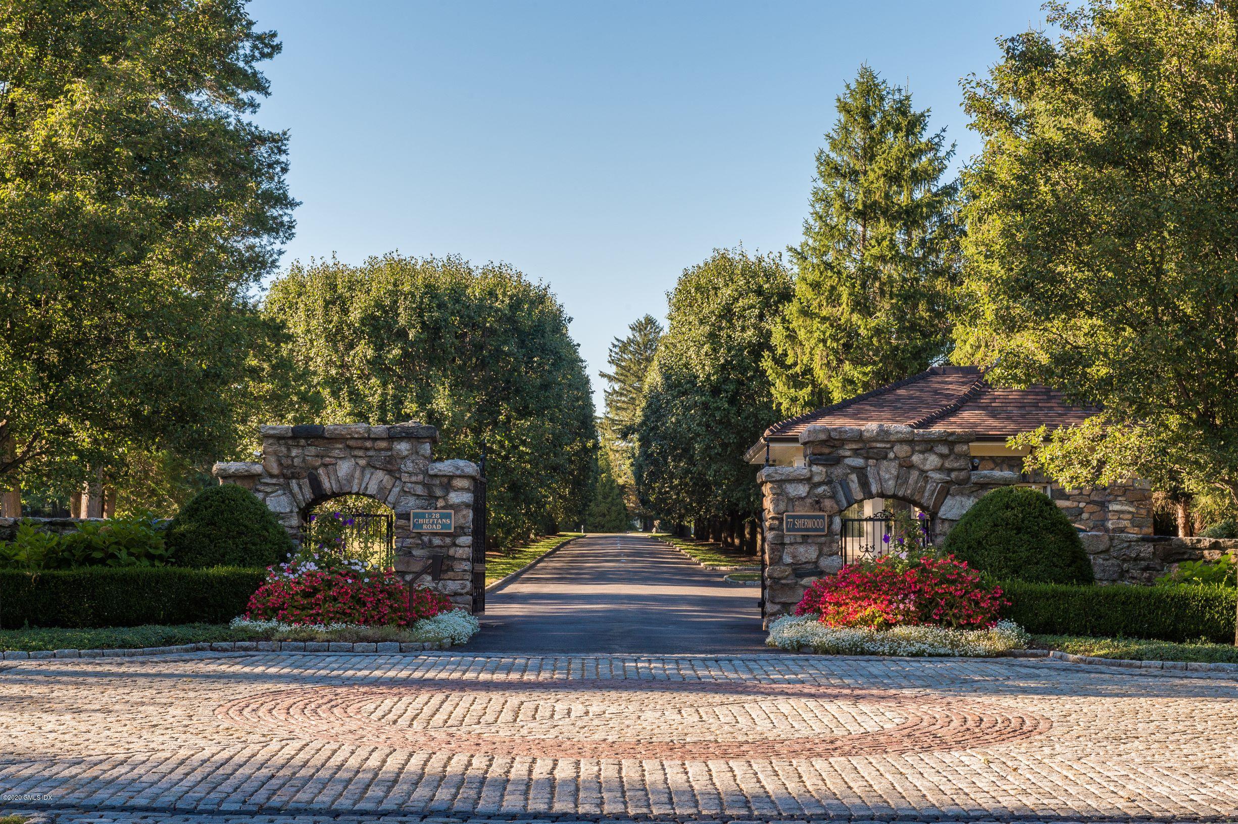 7 Chieftans Road Greenwich, CT 06831 - Photo 2 of 37 a view of a park with large trees