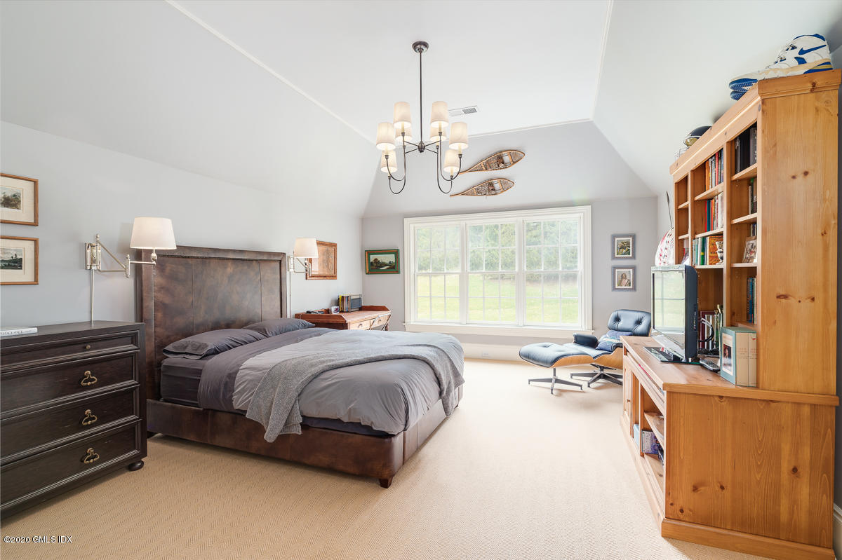 7 Chieftans Road Greenwich, CT 06831 - Photo 22 of 37 a bed room with a bed and a dresser
