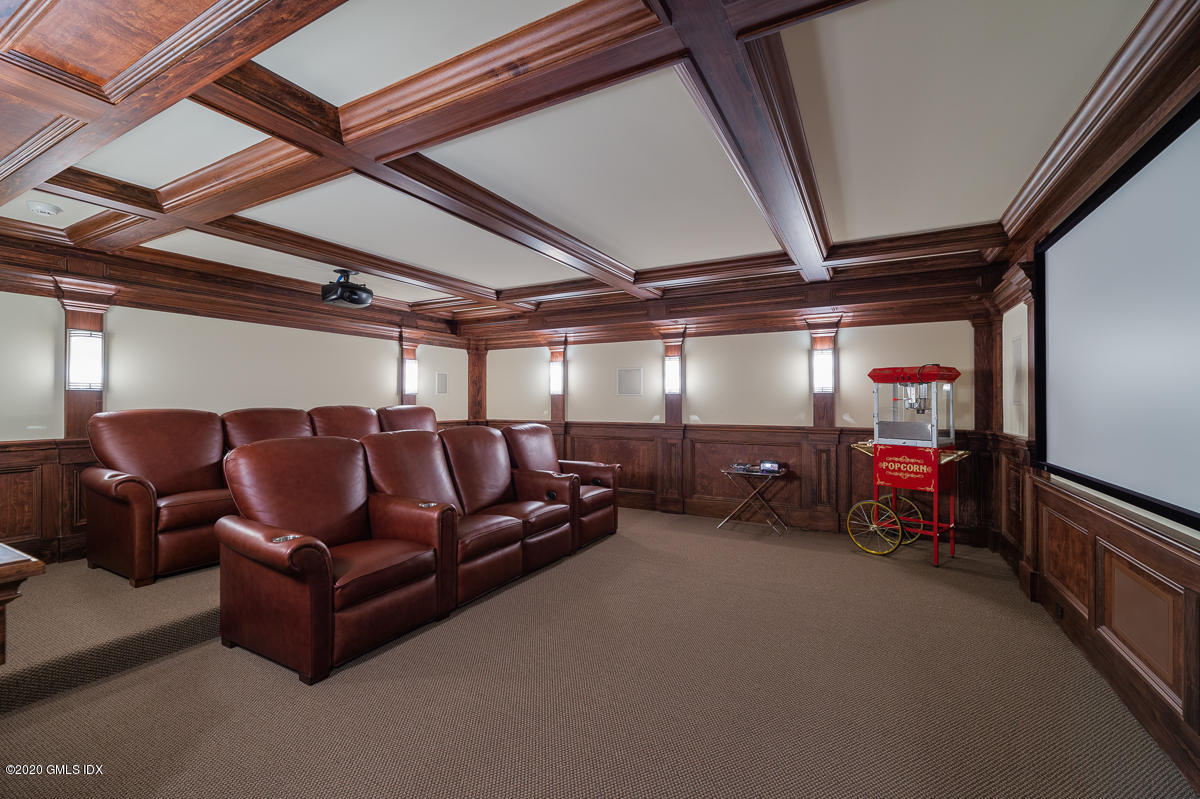 7 Chieftans Road Greenwich, CT 06831 - Photo 26 of 37 a living room with furniture and a couch