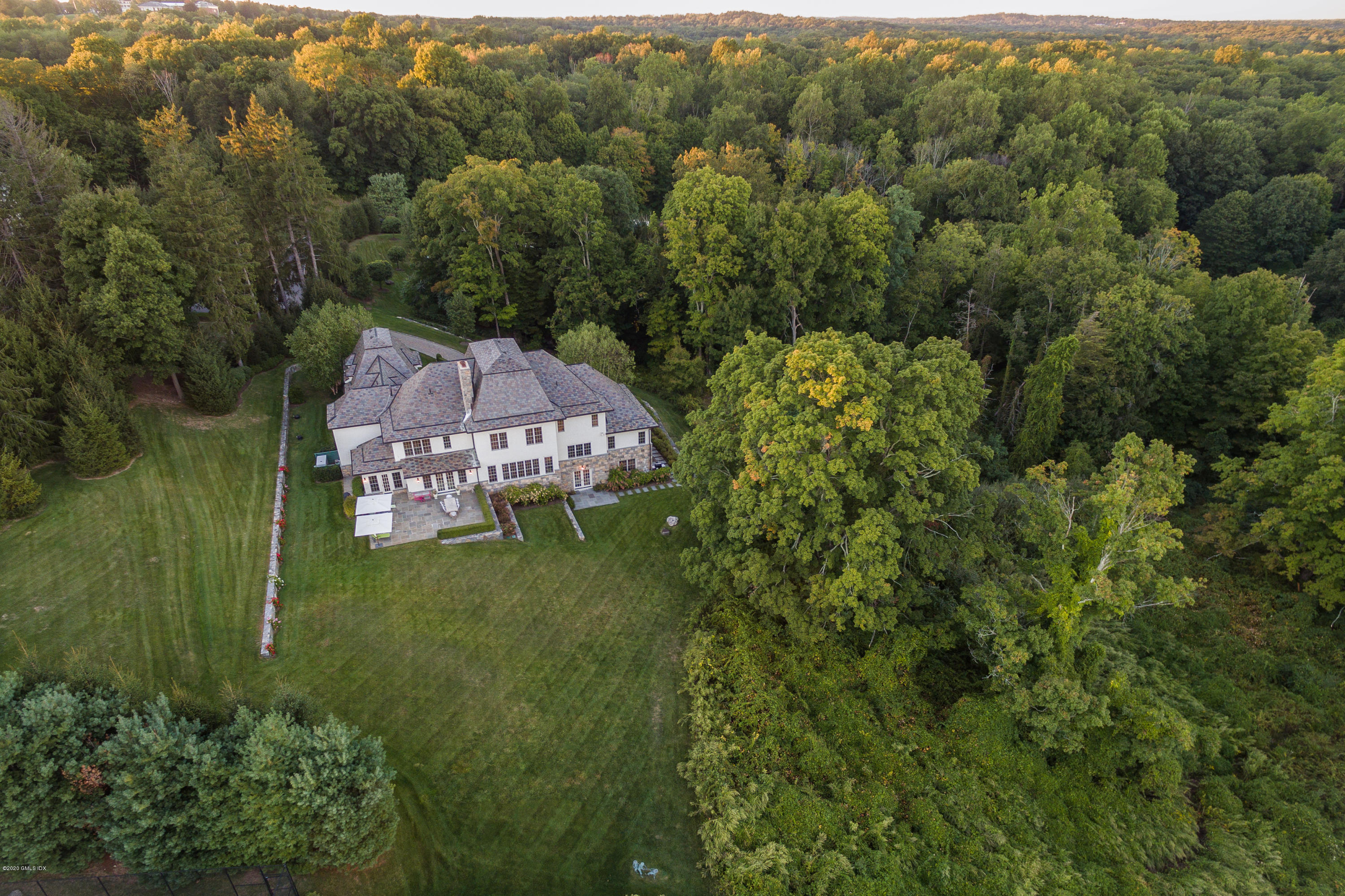 7 Chieftans Road Greenwich, CT 06831 - Photo 34 of 37 an aerial view of a house with a garden