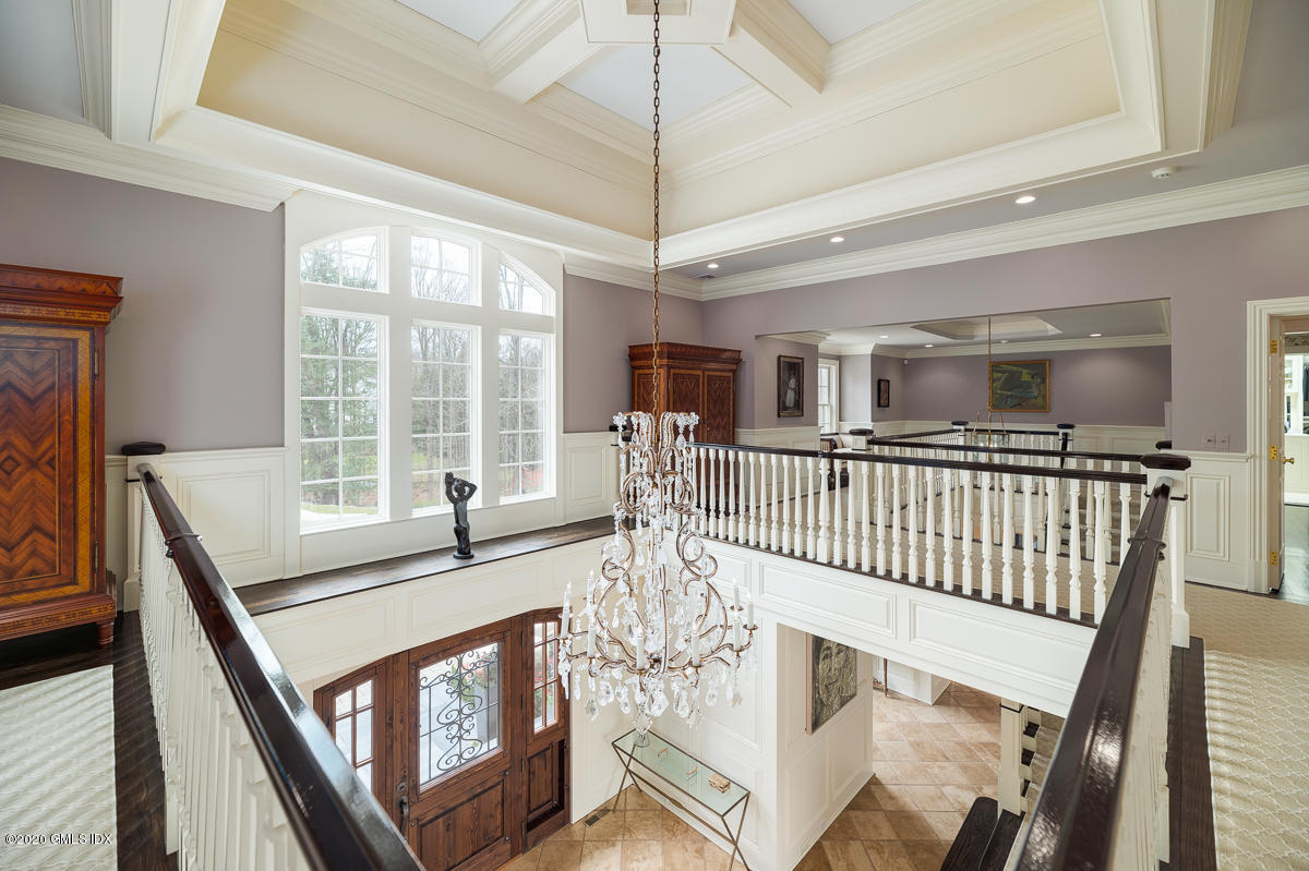 7 Chieftans Road Greenwich, CT 06831 - Photo 5 of 37 a view of an entryway with wooden floor and windows