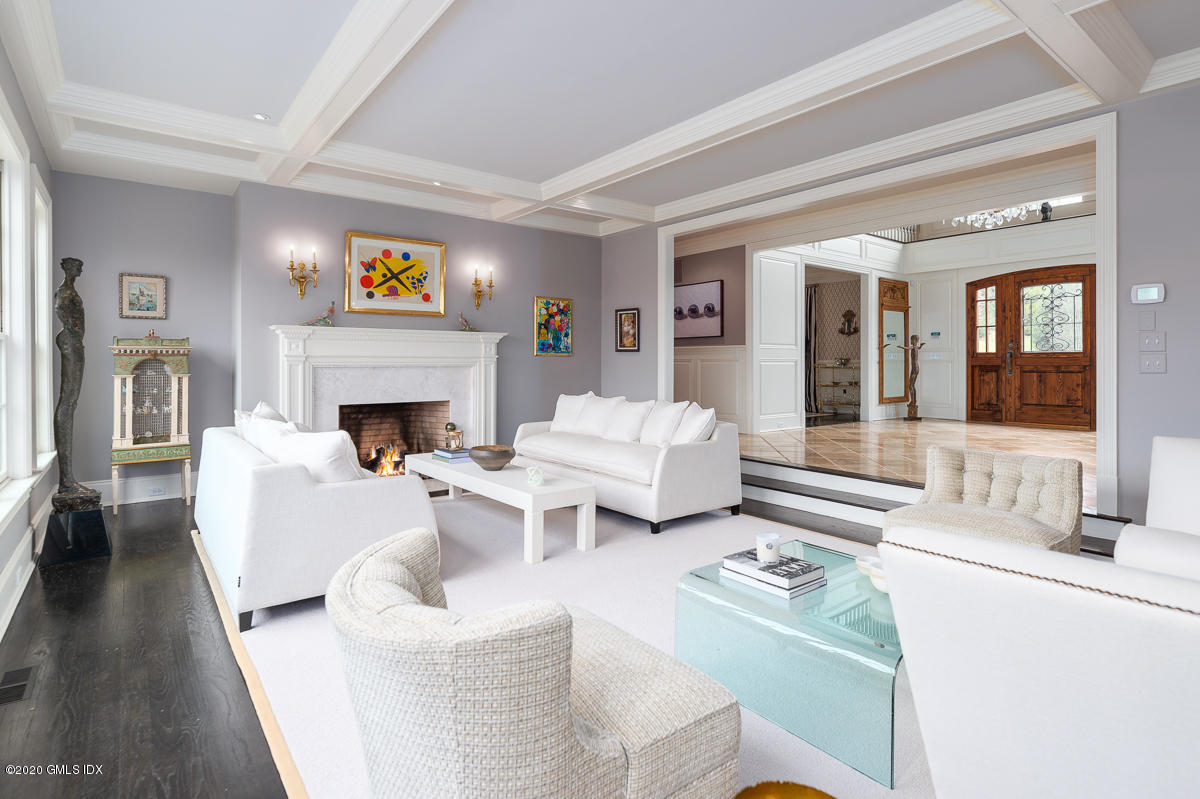 7 Chieftans Road Greenwich, CT 06831 - Photo 7 of 37 a living room with furniture and a fireplace