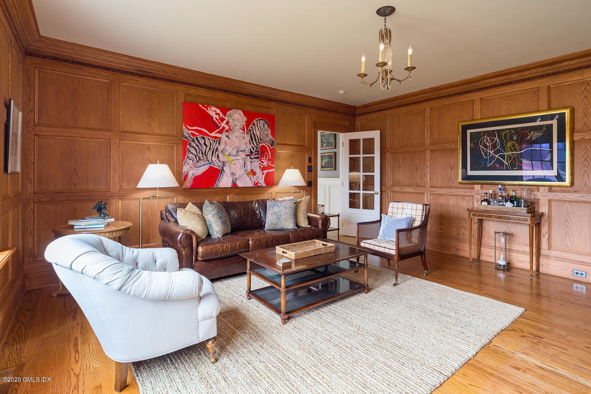 7 Chieftans Road Greenwich, CT 06831 - Photo 10 of 37 a living room with furniture and a flat screen tv