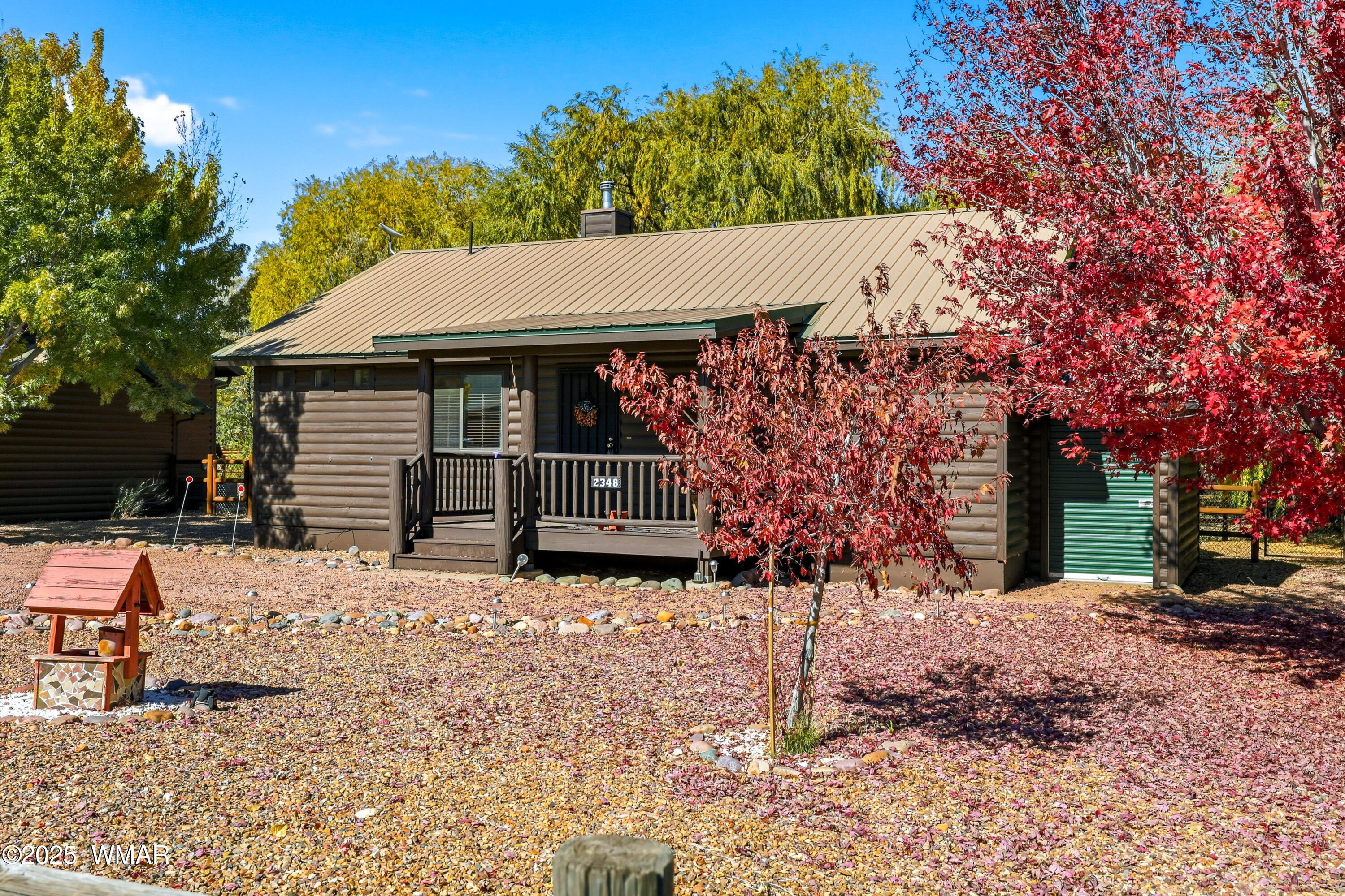 a backyard of a house with barbeque oven