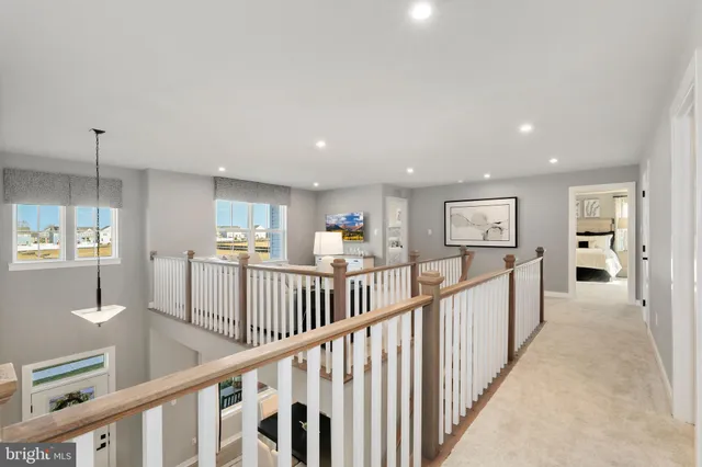 a view of a hallway with window and furniture
