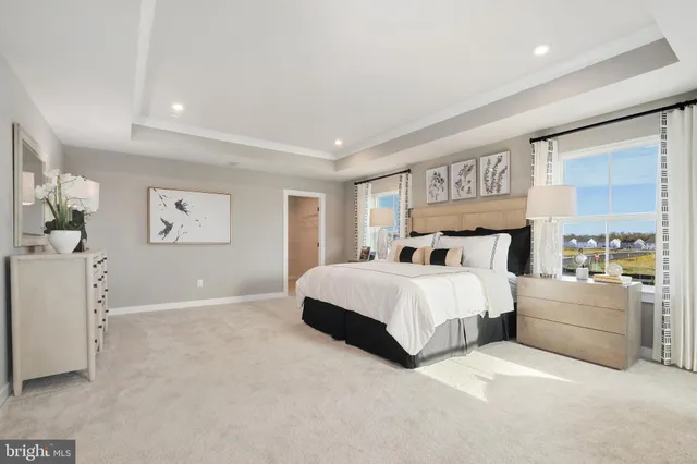 a bedroom with a large bed and a large window