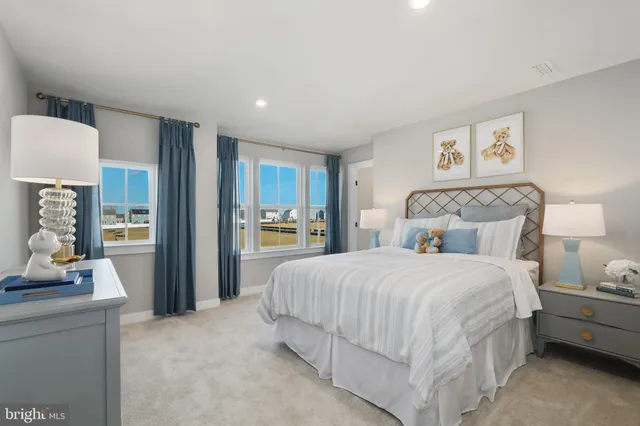 a bedroom with a bed and a couch