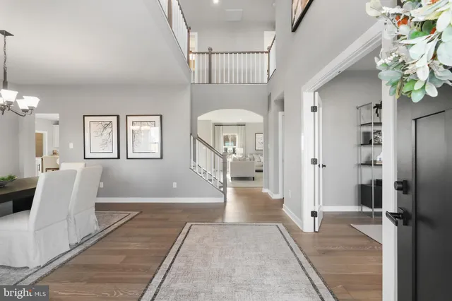 a view of a hallway with windows and stairs