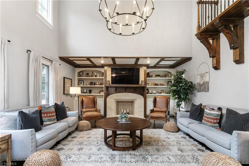 8302 Linville Oaks Drive Oak Ridge, NC 27310 - Photo 17 of 46 The living room opens up to soaring ceilings and a small balcony from above.