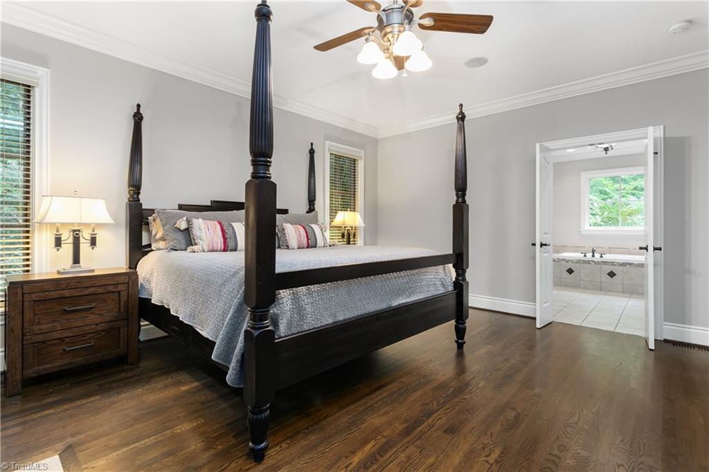8302 Linville Oaks Drive Oak Ridge, NC 27310 - Photo 20 of 46 Primary bedroom on the main level.
