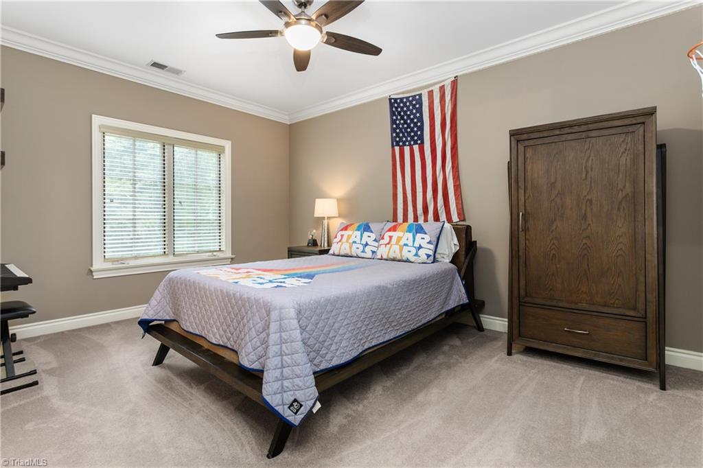 8302 Linville Oaks Drive Oak Ridge, NC 27310 - Photo 27 of 46 Another large bedroom upstairs that connects to the large bath.