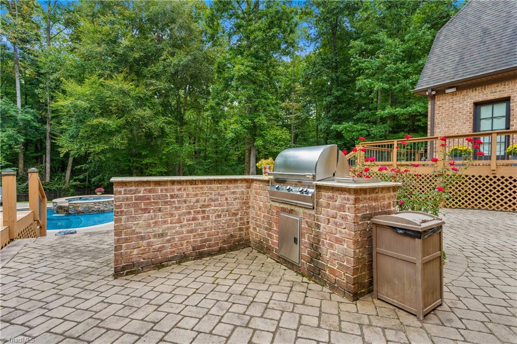 8302 Linville Oaks Drive Oak Ridge, NC 27310 - Photo 41 of 46 Built-in out door grill area.