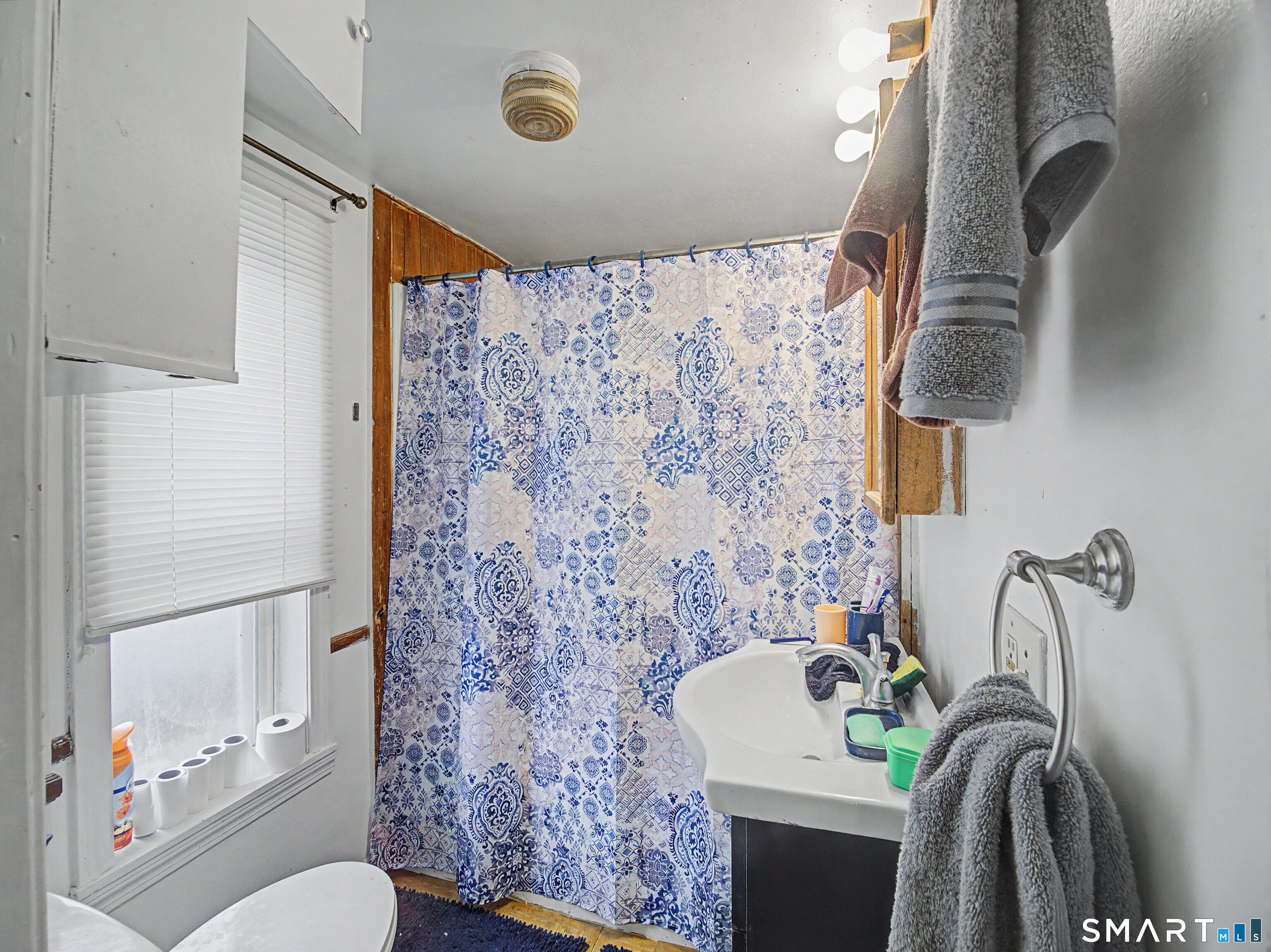 68 Rowan Street Danbury, CT 06810 - Photo 11 of 34 a bathroom with a sink toilet and shower