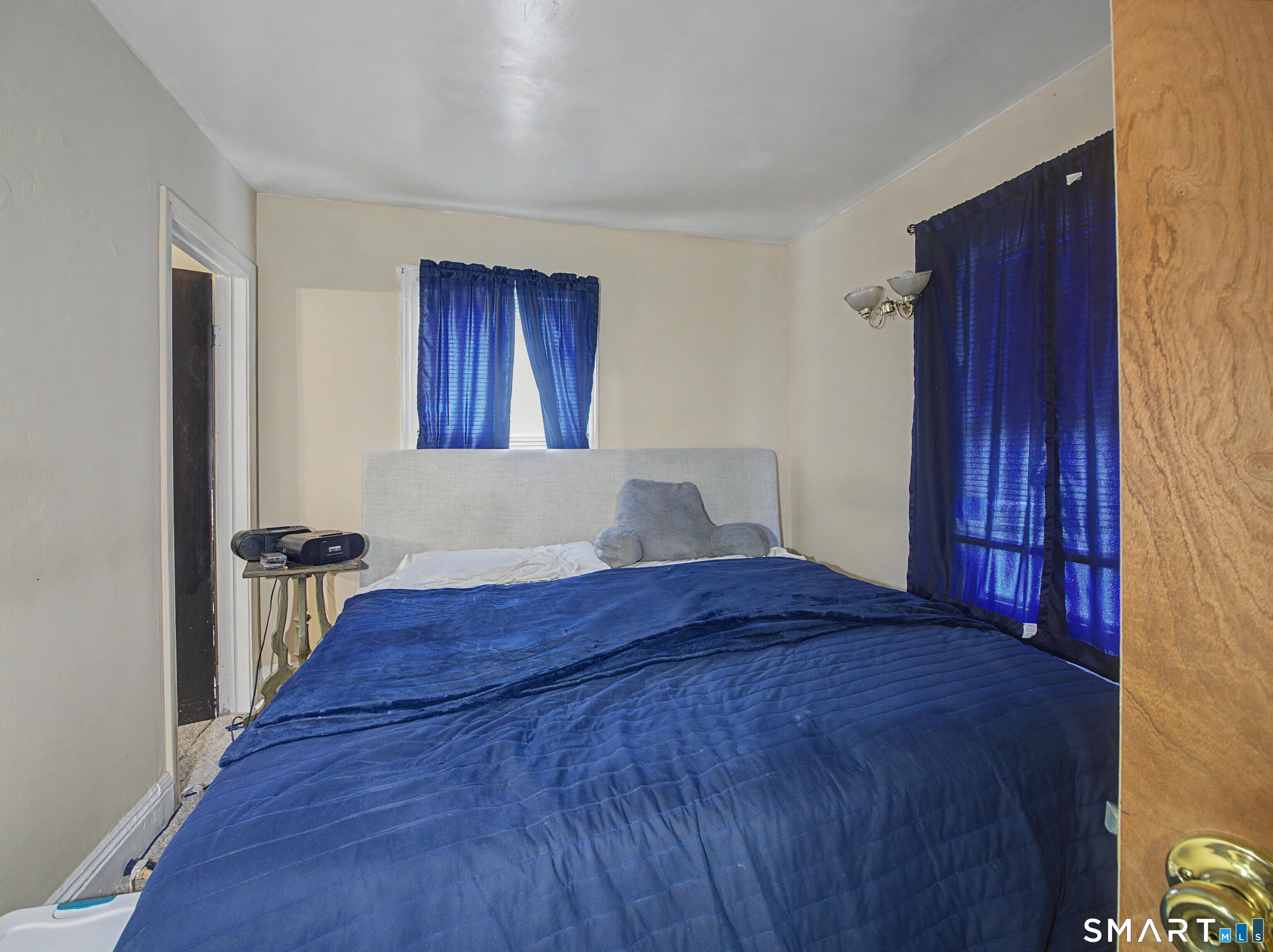 68 Rowan Street Danbury, CT 06810 - Photo 13 of 34 a bedroom with a bed and wooden floor