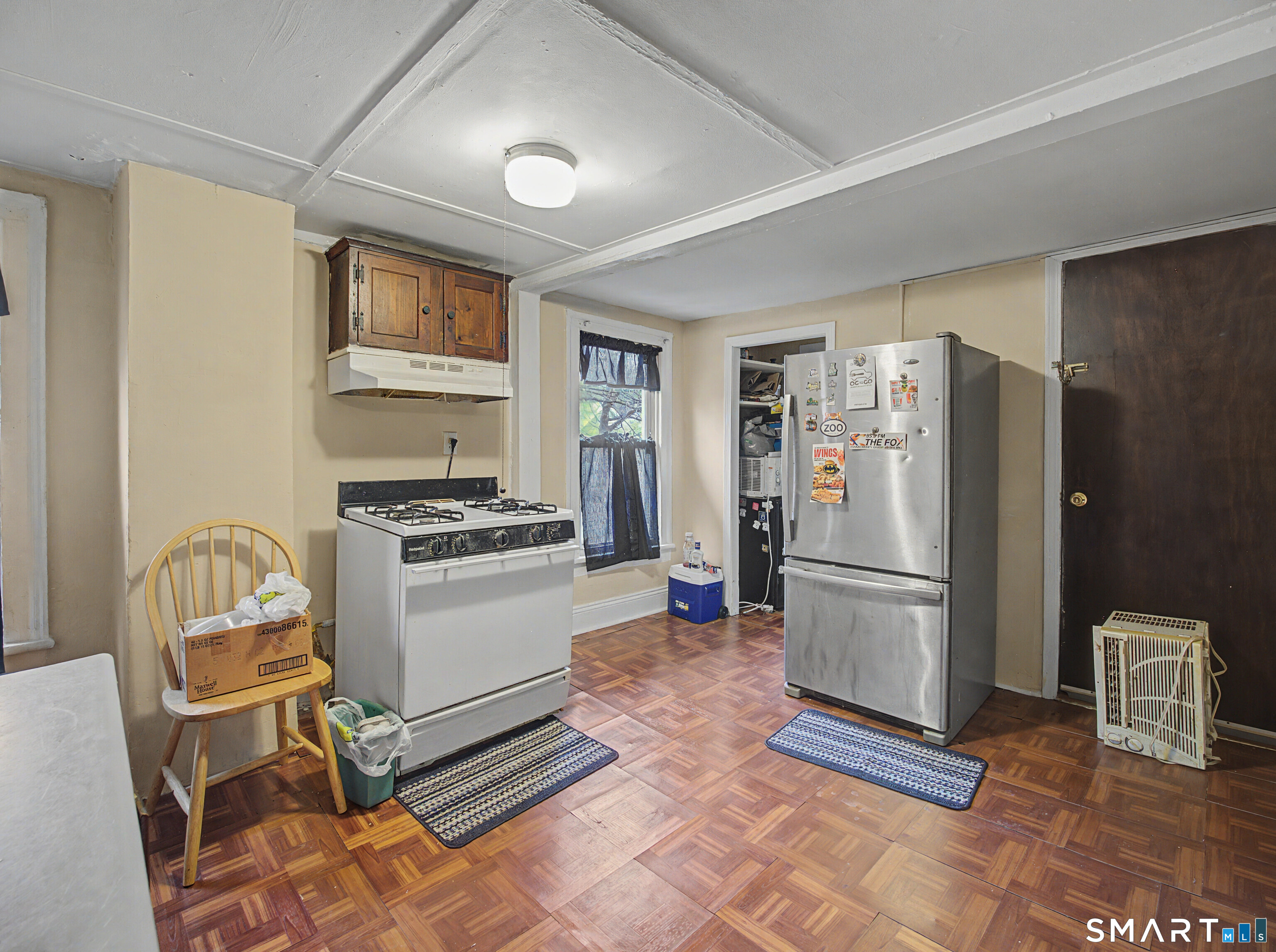 68 Rowan Street Danbury, CT 06810 - Photo 20 of 34 a kitchen with a refrigerator and a stove top oven