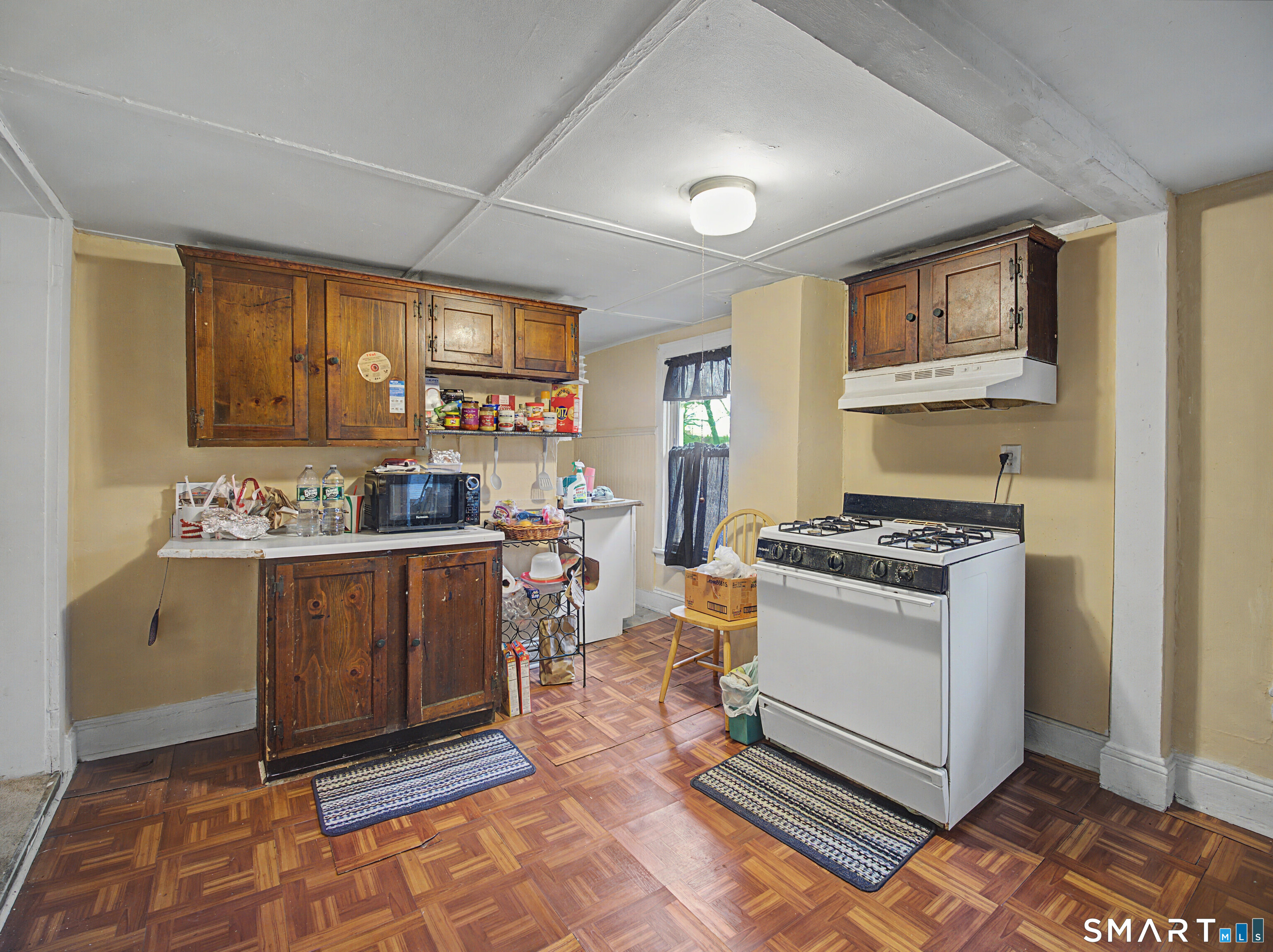 68 Rowan Street Danbury, CT 06810 - Photo 22 of 34 a kitchen with stainless steel appliances granite countertop a stove a sink and a refrigerator