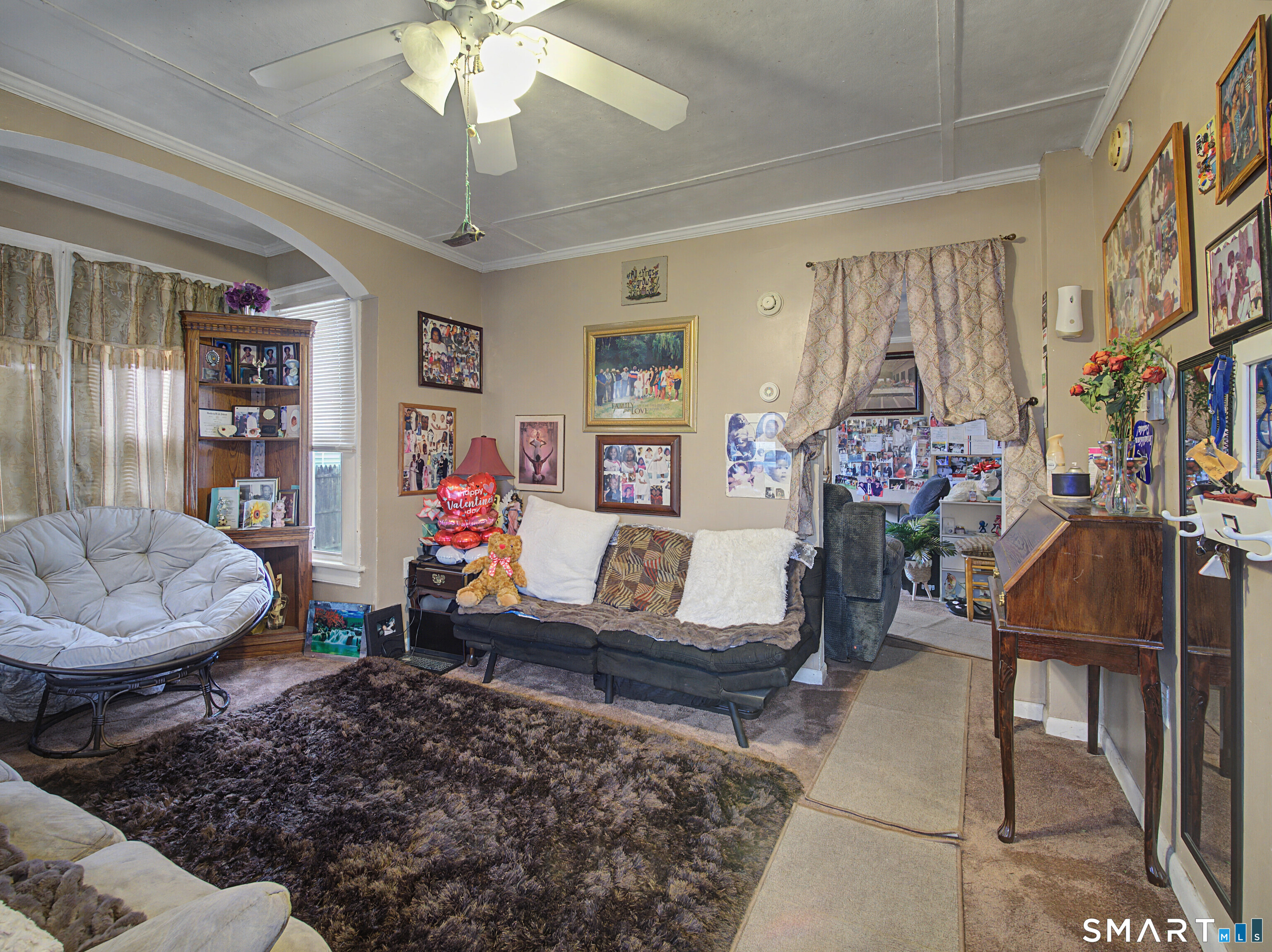 68 Rowan Street Danbury, CT 06810 - Photo 30 of 34 a living room with furniture and a chandelier