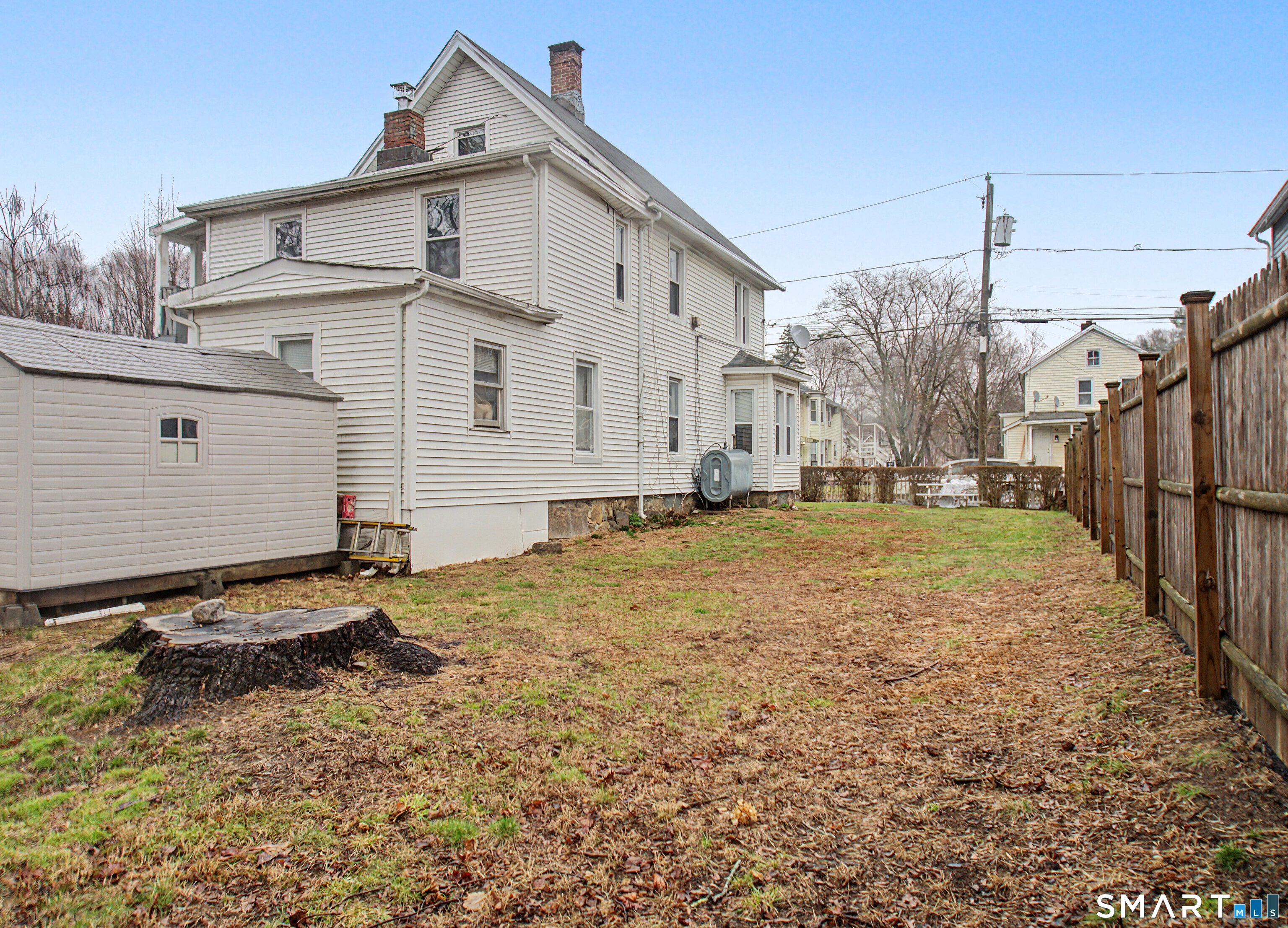 68 Rowan Street Danbury, CT 06810 - Photo 34 of 34 a view of a house with a yard