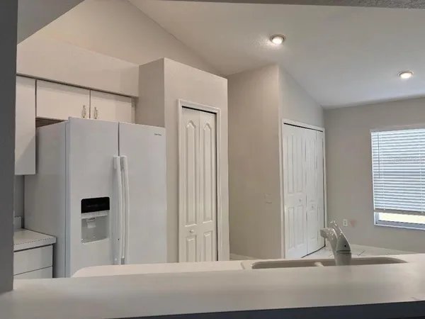 a view of a refrigerator in a room