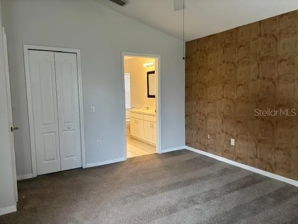 a view of an empty room with a bathroom
