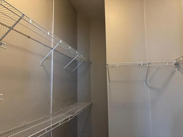 a view of a room with racks on the wall